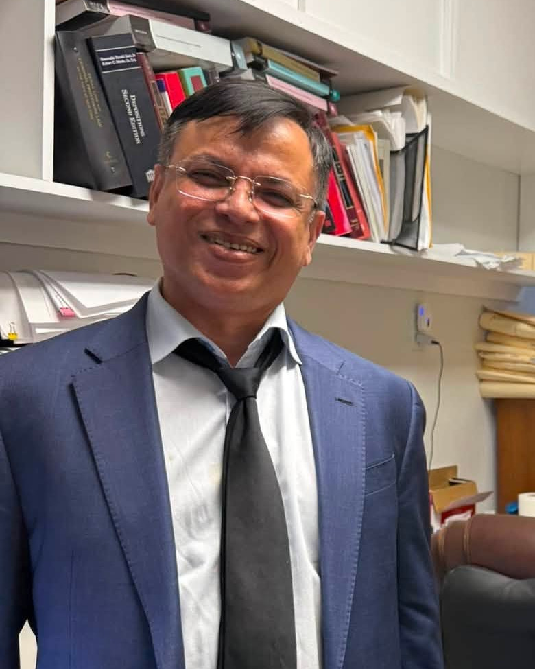 Attorney Mahfuzur Rahman, Esq. in his Elmhurst, Queens office